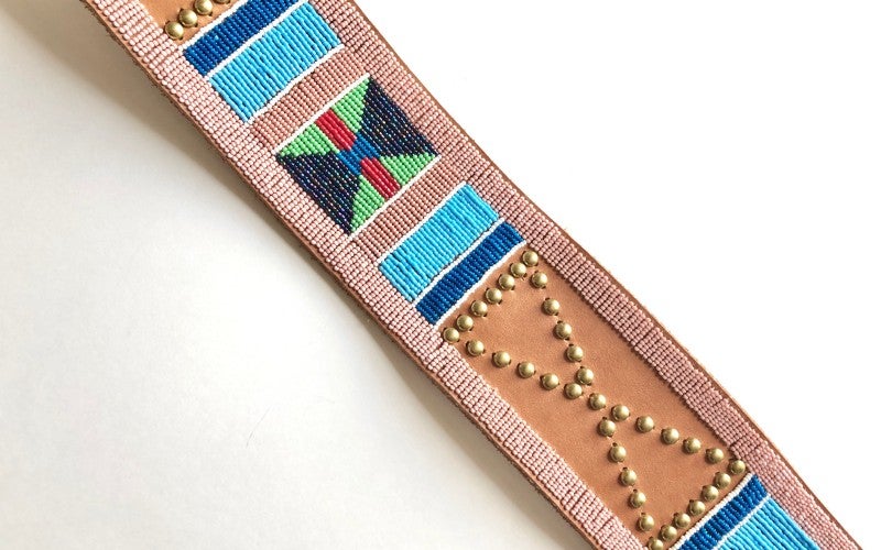 Plateau Panel Belt, made from leather and decorated with beads and metal studs. 