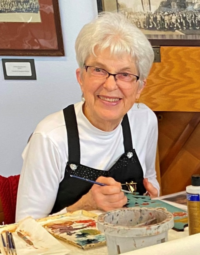 Gayle poses while painting.